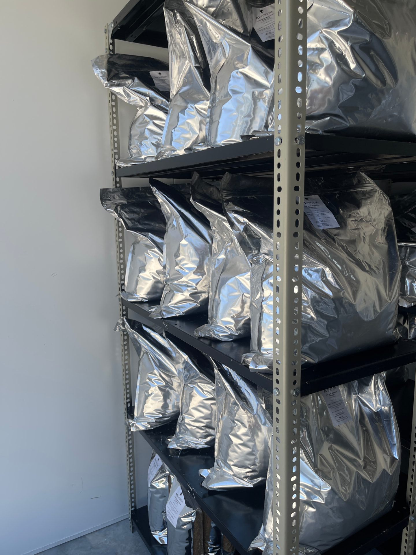 Shelves of packaged Bioshroom mushroom products in foil bags